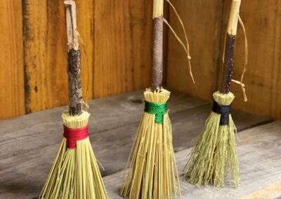 Three Brooms with Wood Handles